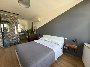 a bedroom with a large bed and a staircase at Li Piagge Guest House in Ascoli Piceno +31 photos