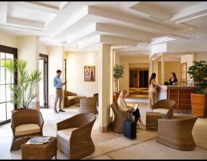 a group of people in a hotel lobby at Villa Bono Romantic Suite & Private Jacuzzi in Saint-Laurent-du-Var +84 photos