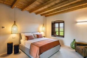 a bedroom with a bed and a window at Suite della Torre in Cavernago