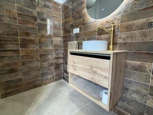 a bathroom with a sink and a mirror at LaJoya Zuheros Suite in Zuheros +58 photos