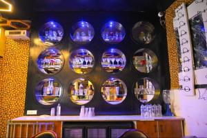 a wall with blue plates on a wall at Hotel First Impression in Rāmnagar
