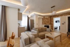 a living room with a couch and a table at Arya Pansiyon Konyaaltı in Antalya
