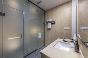 a bathroom with a shower and a sink at Soluna Dalat Hotel in Da Lat +58 photos