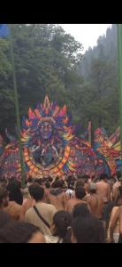 a group of people standing in front of a carnival at House of Brahma Kasol in Kasol