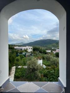 a view of a city from an archway at Zinat outdoor villa in Tétouan +12 photos