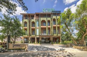 a building with a sign on top of it at Soluna Dalat Hotel in Da Lat