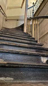 a set of stairs in an old building at Apartament Crooked stairs in Zielona Góra +27 photos