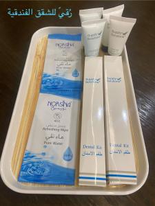 a plastic container with four products in it at رُقيّ للشقق الفندقية rogy VIP in Taif