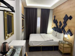 a hotel room with a bed in a room at lily airport otel in Arnavutköy