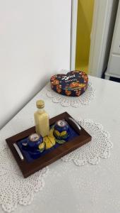 a table with a tray with a bottle of soap at Il borgo di Iaconti in Vietri sul Mare