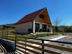 a house with a fence in front of it at Kuća Sunny Rudnik in Rudnik