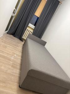 a cardboard box sitting on the floor in a room at Mieszkanie BLOK in Złotów