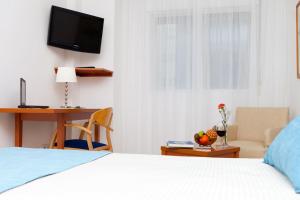 Postel nebo postele na pokoji v ubytování Hotel Verol