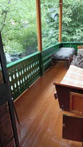 a room with two benches and a large window at Bnakaran dzoragetum in Dzoraget
