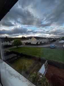 a view from a window of a street with a car at Caol Mountain View in Caol