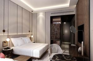 a hotel room with a bed and a chair at Kampala Marriott Hotel in Kampala