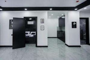 a large room with a bed and a kitchen at Апарт-отель Homeland in Gonio