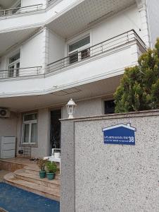 a house with a sign in front of it at Hotel Tabidze in Batumi