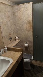 a bathroom with a sink and a toilet and a tub at Elis Studio Luxury Apartment in Ierapetra +33 photos