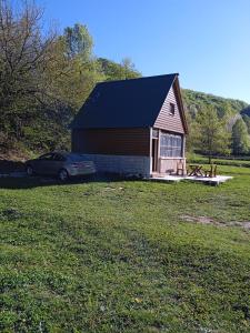 a car parked in front of a small house at -DO- Gradac in Šavnik +15 photos