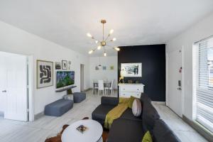 a living room with a couch and a table at 8040 Harding Apts in Miami Beach
