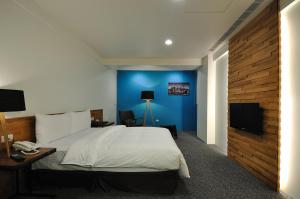 TV a/nebo společenská místnost v ubytování Sun Sweet Hotel