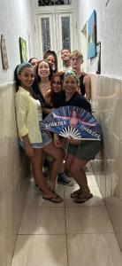 a group of girls posing in a bathroom mirror at Hostel Cidade Nova, próximo a estação metrô praça 11, onde você tem acesso direto a quaisquer Shows nas praias da zona Sul in Rio de Janeiro