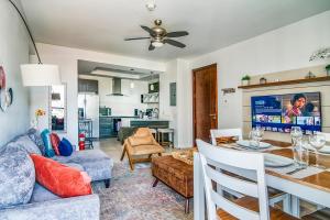a living room with a table and a couch at Airy Modern 2br Condo Rooftop Pool in Kingston