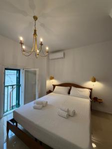 a bedroom with a bed with two towels on it at Sea Breeze Terrace in Monopoli