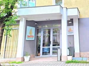 a building with a entrance to a store at Hotel VIVA in Sofia