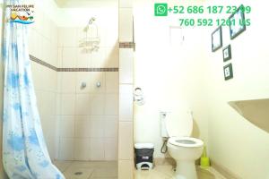 a bathroom with a toilet and a shower at 1-Bedroom Beach Studio - Serene getaways. in San Felipe +23 photos
