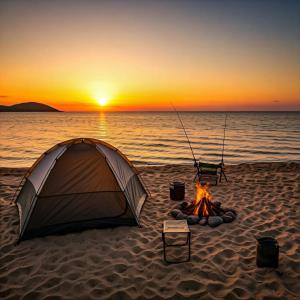a tent on the beach with a camp fire at Elenas Campsite in San Vicente