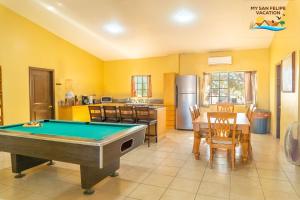 a kitchen with a pool table in a room at Paradise home in Rancho Percebu in San Felipe