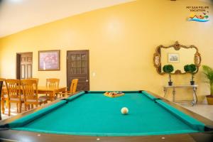 a room with a pool table and a dining room at Paradise home in Rancho Percebu in San Felipe