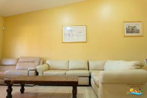a living room with a couch and a coffee table at Paradise home in Rancho Percebu in San Felipe