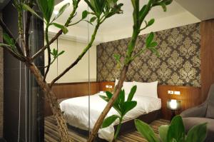 Postel nebo postele na pokoji v ubytování Sun Sweet Hotel