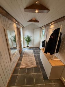 a hallway of a house with a room with a floor at Spacious flat 15 min to the beach in Falkenberg +7 photos