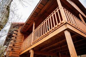 a large wooden deck on the side of a building at Buckeye Bungalow in Logan