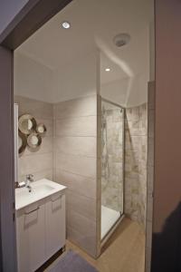 a bathroom with a shower and a sink and a toilet at Le presbytère de thiat in Thiat +26 photos