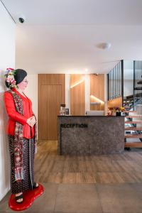 a statue of a woman standing in a room at Dhipa Kinanthi Prawirotaman by Raminten in Timuran +46 photos