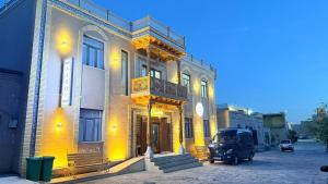 a truck is parked in front of a building at Saroy Khiva in Khiva