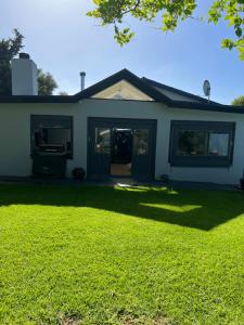 a house with a lawn in front of it at Almond Place in Tokai
