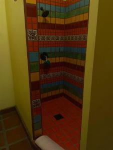 a bathroom with a shower with colorful tile at Casa Serenidad familiar escapade in San Felipe