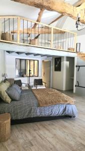 a large bedroom with a large bed in a building at Chambres d'hotes "Chez Marchio" in Crottet