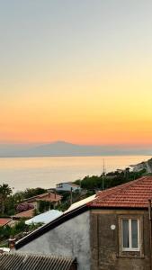 a view of the ocean from the roof of a building at RaJan Home Blue in Palizzi Marina