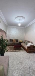 a living room with a couch and a ceiling at DowntownHouse in Midelt in Midelt +1 photo