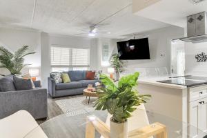 a living room with a couch and a table at < 2 Mi to Coast: St Pete Beach Gem w/ Pool Access in St. Pete Beach