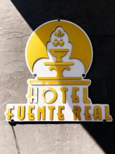 a sign for a hotelille real sign on a table at Hotel Fuente Real Popayán in Popayan