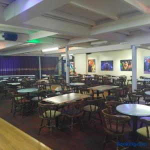 a dining room with tables and chairs in a building at Dawlish Warren Welcome family holiday park South Devon Willow villa Welcome2Warren in Dawlish Warren