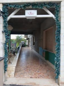 an empty hallway with a blue garland on a building at Suite 7 &Home Restaurant in Paglieta